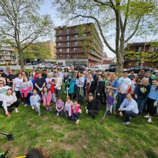 A group photo of Bay Ridge Environmental Group volunteers posing after a major park cleanup event in Cannonball Park (John Paul Jones Park).